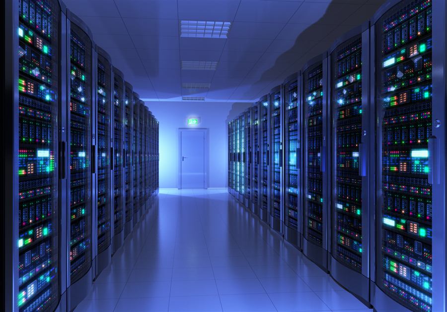Illuminated data center aisle lined with server racks